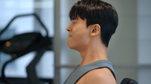 Man exercising in a gym with focus