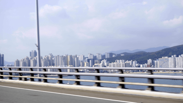 City skyline viewed from a moving bridge