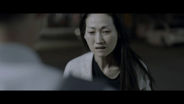 Woman making student look back in dark street