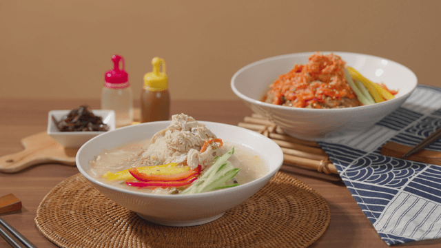 Cold chicken noodles with vegetables and spicy noodles in Korean style