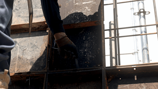 Worker assembling metal framework