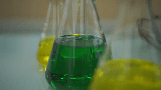 Colorful liquids in laboratory flasks