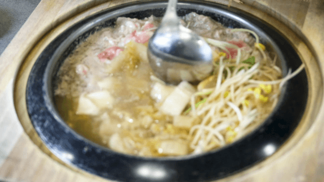 White ripened kimchi stew with bean sprouts and beef brisket