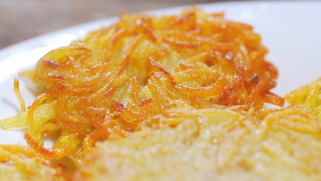 Crispy golden potato pancakes on a plate