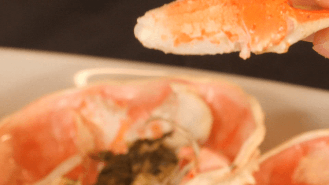 Crab tongs being peeled by hand