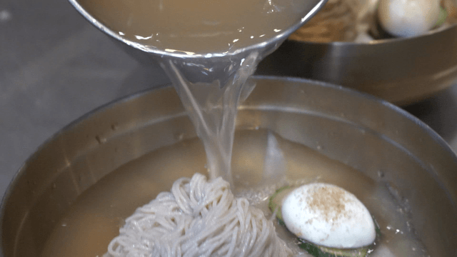 Cold broth poured onto buckwheat noodles