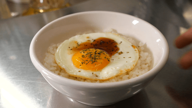 Rice bowl topped with soy sauce fried egg