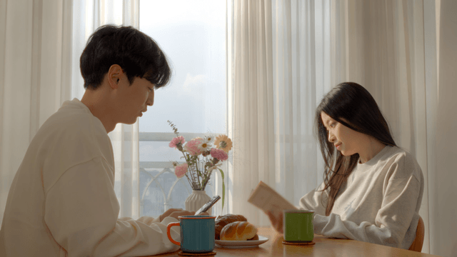 Couple starting morning talk after reading book and smartphone