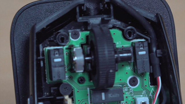 Cleaning dust from computer mouse circuit board