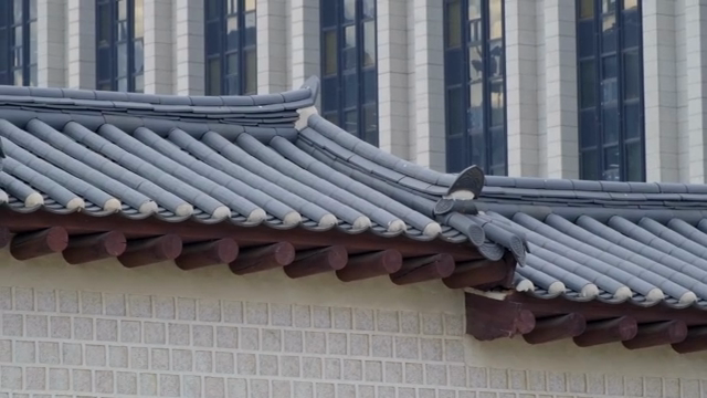 Traditional Korean roof with modern building