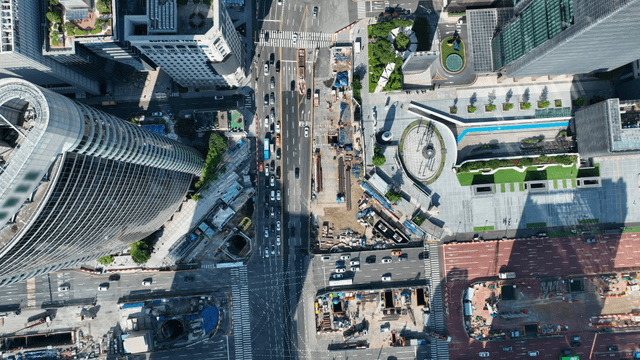 A bustling city intersection with traffic