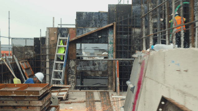 Construction site with workers and equipment