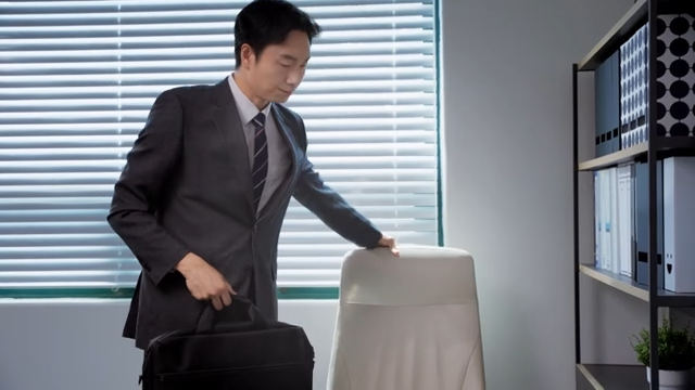 A businessman leaving the office after finishing work