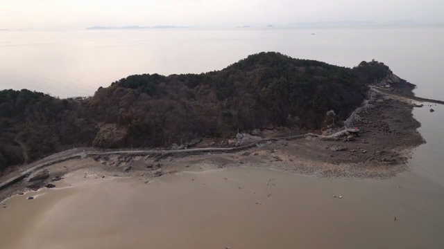 A serene coastal landscape with a beach
