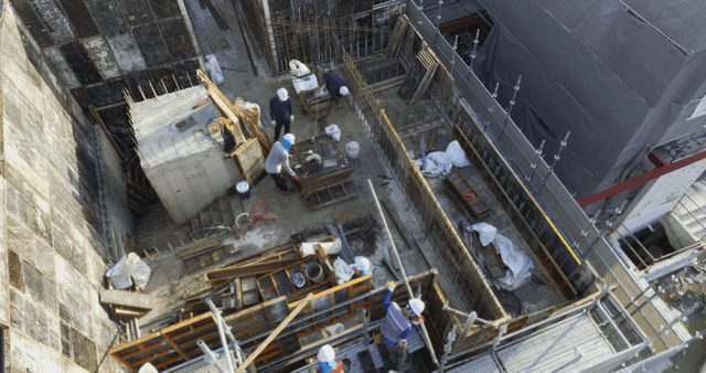 Construction workers building a structure