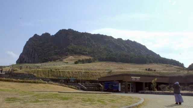 A scenic view of a mountain and visitor center