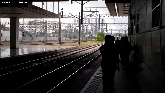 People waiting at a train station platform