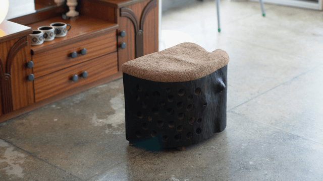 Unique wooden chair in a cozy indoor space