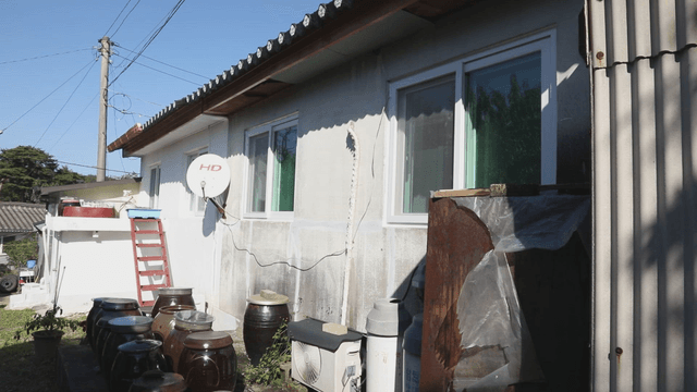 Rural house with jars outside