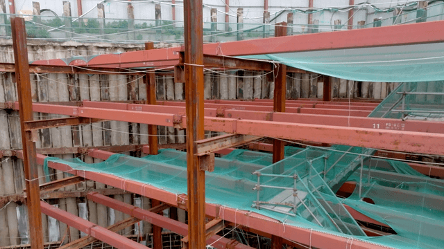 Construction site with metal beams and netting
