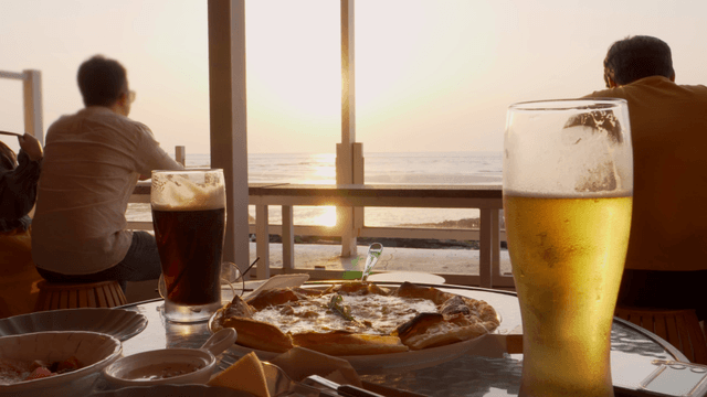 Dining by the seaside at sunset