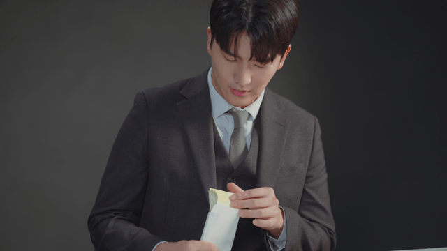 Man checking the money inside an envelope
