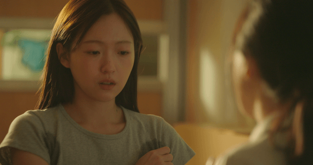 Student in a school uniform sweating after talking with a friend