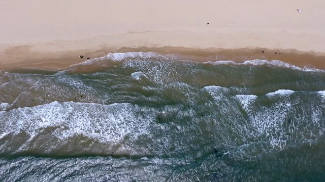 Waves gently crashing on a sandy beach