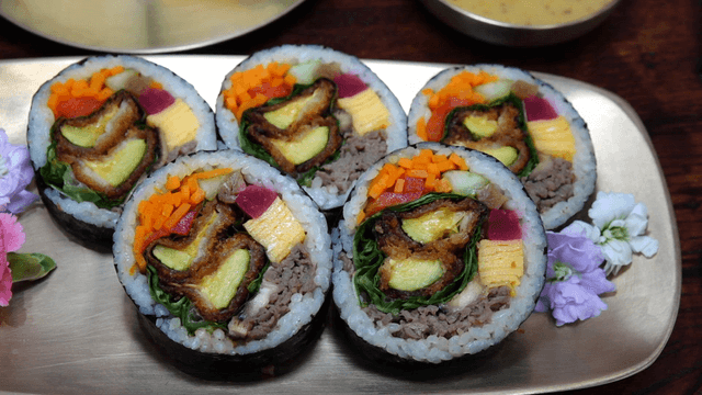 Colorful pumpkin gimbap on a plate