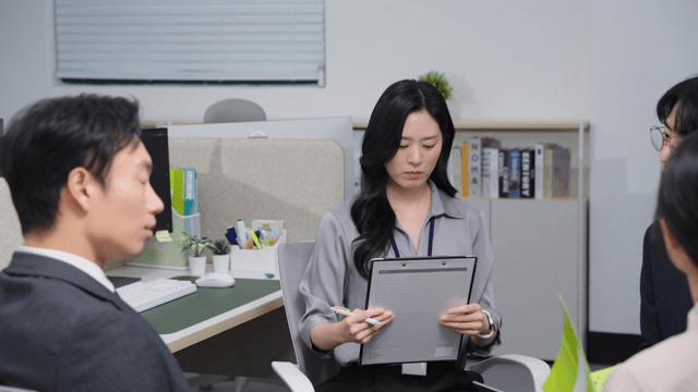 Office meeting with four colleagues