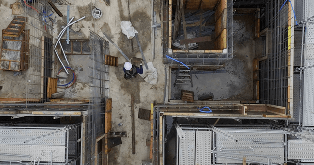Construction site with workers and materials