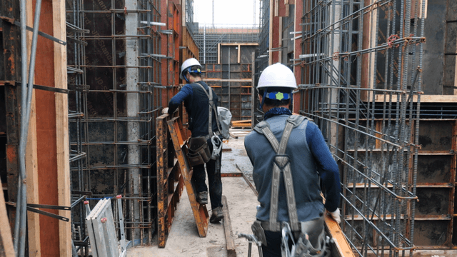 Construction worker handling materials