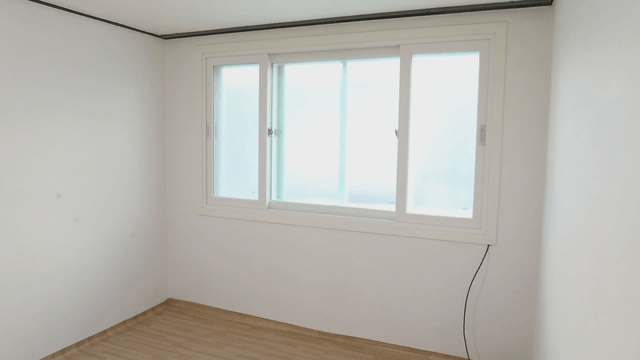 Empty room with large windows