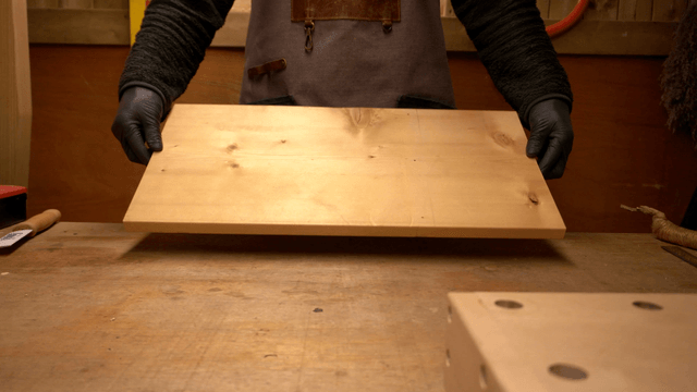 Carpenter preparing wooden boards