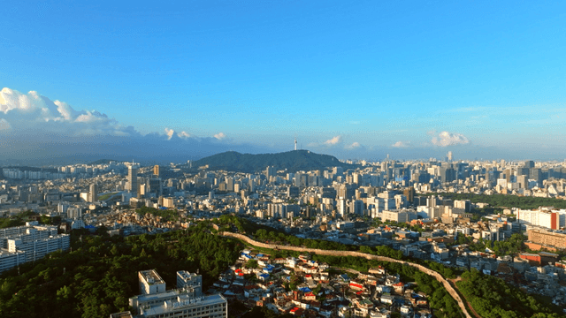 Sprawling cityscape with distant mountains