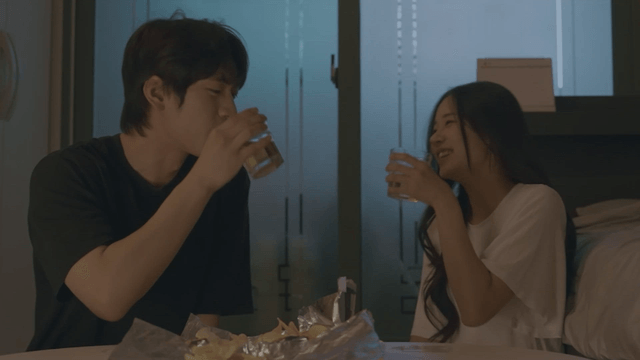 Couple drinking beer at home