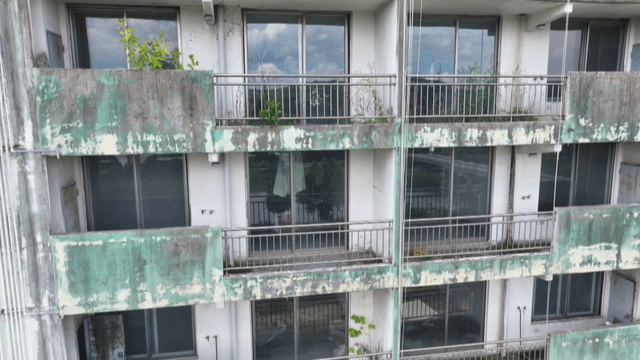 Old apartment building with peeling paint