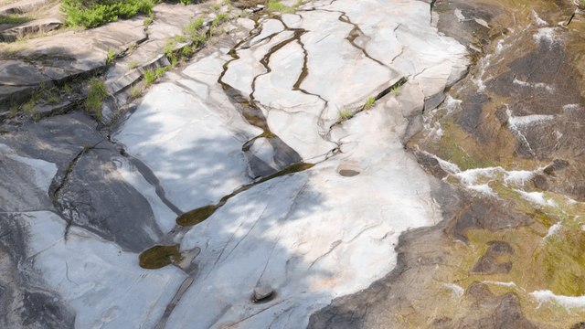 Rocky creek bed with shallow flowing water