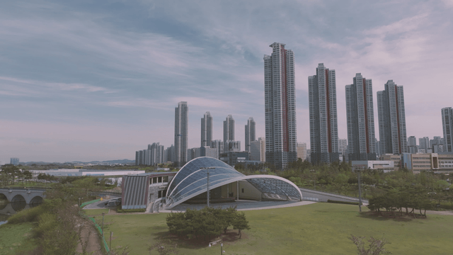 Modern city skyline with green park