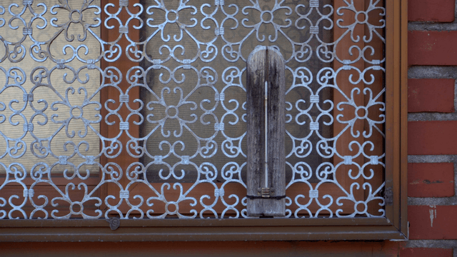 Wooden carving window frame with repeating patterns