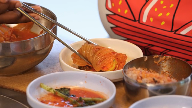 Rolled omelet served with kimchi