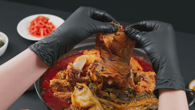 Hand deboning pork backbone stew