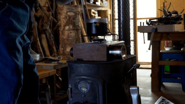 Mess tin on a gas burner in the workshop