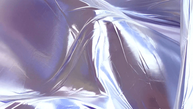 Flowing iridescent fabric with purple hues