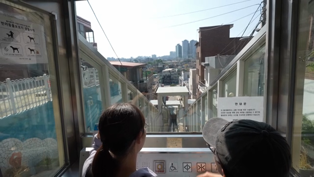 Riding an outdoor elevator in the residential area