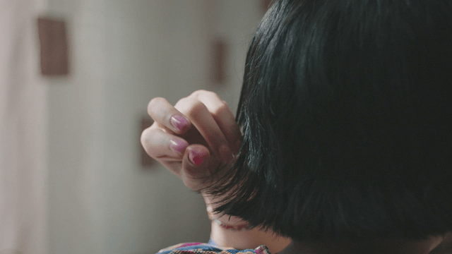 Woman fixing her hair
