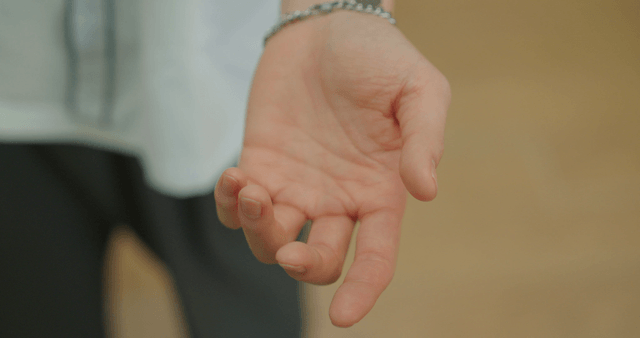 Hand with a bracelet in focus