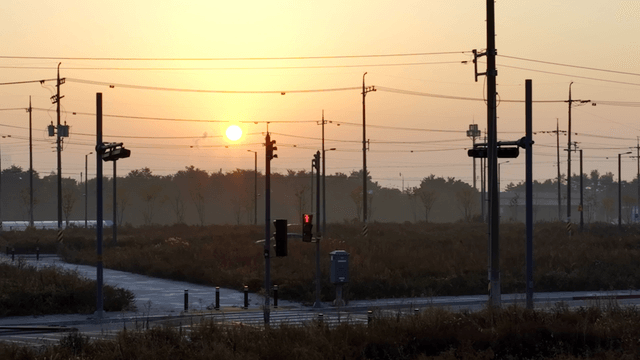Sunset over a quiet intersection crosswalk