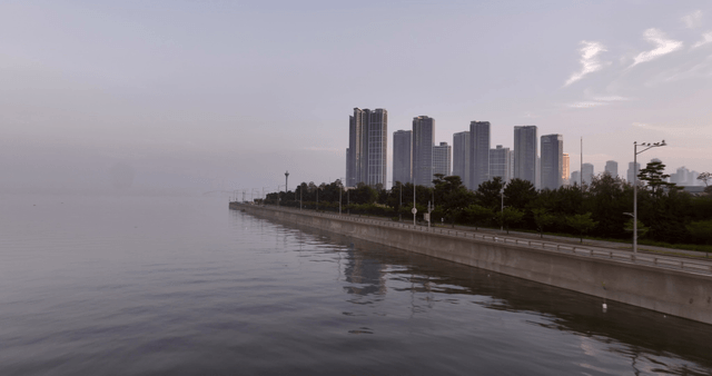 Serene coastal cityscape at dawn