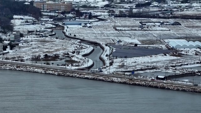 snow-covered farmland and village